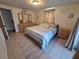 Bedroom featuring a queen bed, coordinated bedding, and a matching nightstand at 3252 Columbus Dr, Holiday, FL 34691