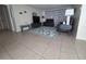 Inviting living room featuring modern furniture, decorative accents, and a stylish area rug at 3252 Columbus Dr, Holiday, FL 34691