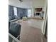 Bright sunroom with tile floors, comfortable seating, and charming blue curtains at 3252 Columbus Dr, Holiday, FL 34691