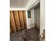 Bedroom view showing the exposed studs and an electrical panel at 34767 Evergreen Way, Ridge Manor, FL 33523
