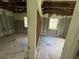 The living room is showing exposed walls, flooring, and ceiling; the space is in need of renovations to be habitable at 34767 Evergreen Way, Ridge Manor, FL 33523