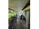 Covered patio space, featuring an overhead view of the screened in pool and surrounding seating area, awaiting renovation at 34767 Evergreen Way, Ridge Manor, FL 33523