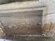 Close-up of a damaged wall with peeling paint and exposed wood, showcasing need for repair at 34767 Evergreen Way, Ridge Manor, FL 33523
