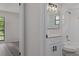 Updated bathroom features granite vanity and modern fixtures at 3498 Plaza Ave, Spring Hill, FL 34608
