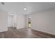 Bright bedroom featuring wood flooring and a natural light filled window at 3498 Plaza Ave, Spring Hill, FL 34608
