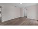 Empty bedroom featuring wood-look floors and a double door closet at 3498 Plaza Ave, Spring Hill, FL 34608
