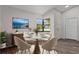 Dining room features wood-look flooring and corner window providing plenty of natural light at 3498 Plaza Ave, Spring Hill, FL 34608