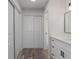 Hallway includes closet and leads to bathroom with granite vanity at 3498 Plaza Ave, Spring Hill, FL 34608