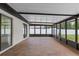 Screened porch featuring overhead awning and access to backyard at 3498 Plaza Ave, Spring Hill, FL 34608