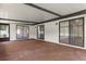 Open screened porch with multiple sliding glass doors at 3498 Plaza Ave, Spring Hill, FL 34608