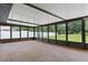 Open screened porch with concrete floors and views of the backyard at 3498 Plaza Ave, Spring Hill, FL 34608