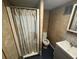 Compact bathroom features a shower, toilet, and vanity, perfect for functionality at 4027 31St N Ave, St Petersburg, FL 33713