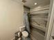 Accessible bathroom featuring updated marble-look surround, grab bars, and neutral fixtures at 4027 31St N Ave, St Petersburg, FL 33713