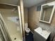 Compact bathroom features a shower, toilet, and vanity, perfect for functionality at 4027 31St N Ave, St Petersburg, FL 33713