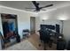 Bedroom features a closet, ceiling fan, and a gaming computer setup at 4027 31St N Ave, St Petersburg, FL 33713