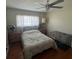 Well-lit bedroom featuring a comfy bed, window with curtains, and a hardwood floor at 4027 31St N Ave, St Petersburg, FL 33713