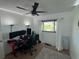Bedroom with a ceiling fan, a window, and three computer screens at 4027 31St N Ave, St Petersburg, FL 33713