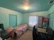 Cozy bedroom with a desk, workspace, and a brightly colored ceiling and walls at 4027 31St N Ave, St Petersburg, FL 33713