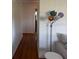 Hallway with wood floors and a colorful lamp stands near a white sofa at 4027 31St N Ave, St Petersburg, FL 33713