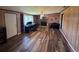 Spacious living room with wood flooring, brick accent wall, and comfortable workspace at 4027 31St N Ave, St Petersburg, FL 33713