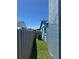 A view of the side yard featuring green grass, a fence, and the exterior of the home at 4027 31St N Ave, St Petersburg, FL 33713