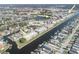 Aerial view of neighborhood on a canal, with annotation for two pool locations at 4452 Garnet Dr # 302, New Port Richey, FL 34652