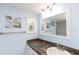Bright bathroom featuring granite countertop, vanity, and whimsical fish decor at 4452 Garnet Dr # 302, New Port Richey, FL 34652