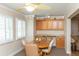 Cozy dining area with built-in cabinets, bright windows, and a neutral color palette at 4452 Garnet Dr # 302, New Port Richey, FL 34652