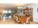 Inviting dining room with wood table, china cabinet, and views of the living room at 4452 Garnet Dr # 302, New Port Richey, FL 34652