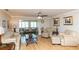 Spacious living room with comfortable seating, wood floors and plenty of natural light at 4452 Garnet Dr # 302, New Port Richey, FL 34652