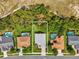 Aerial view of the home with a pool in a neighborhood at 489 Tournament Dr, Spring Hill, FL 34608