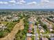 Aerial view of neighborhood showcasing lush greenery and well-maintained homes at 489 Tournament Dr, Spring Hill, FL 34608
