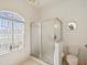 Bathroom featuring a glass-enclosed shower and a toilet at 489 Tournament Dr, Spring Hill, FL 34608