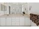 Bright bathroom featuring a double sink vanity, and a large mirror at 489 Tournament Dr, Spring Hill, FL 34608