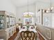 Formal dining room with a large window and elegant furnishings at 489 Tournament Dr, Spring Hill, FL 34608