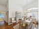 Formal dining room with elegant decor and a view of the backyard at 489 Tournament Dr, Spring Hill, FL 34608