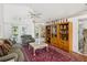 Inviting living room with comfortable seating, hardwood floors, and plenty of natural light at 489 Tournament Dr, Spring Hill, FL 34608