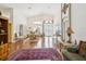 Elegant living room with hardwood floors, high ceilings, and dining area at 489 Tournament Dr, Spring Hill, FL 34608