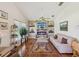 Comfortable living room featuring a fireplace, hardwood floors, and natural light at 489 Tournament Dr, Spring Hill, FL 34608