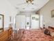 Large main bedroom showcasing wood floors, a ceiling fan, and neutral wall colors at 489 Tournament Dr, Spring Hill, FL 34608