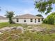 This home includes a backyard with a small concrete patio area, great for relaxing outside at 5048 Teather St, Spring Hill, FL 34608