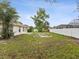 Expansive backyard with a white privacy fence offering ample space for outdoor activities at 5048 Teather St, Spring Hill, FL 34608