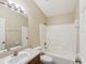 Cozy bathroom featuring a shower and tub combination with a single sink vanity at 5048 Teather St, Spring Hill, FL 34608