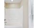 Bathroom highlighting a shower with a built-in seat and ample natural light through a window at 5048 Teather St, Spring Hill, FL 34608