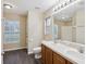 Bathroom featuring a double sink vanity, a large mirror, and modern fixtures at 5048 Teather St, Spring Hill, FL 34608