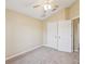 Neutral bedroom with vaulted ceiling, ceiling fan and a large closet space at 5048 Teather St, Spring Hill, FL 34608