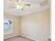 Bedroom featuring carpet, neutral walls, ceiling fan and a window with natural light at 5048 Teather St, Spring Hill, FL 34608