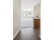 Inviting hallway with a view into the carpeted living area, showcasing an open-concept design at 5048 Teather St, Spring Hill, FL 34608