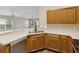 A functional kitchen featuring stainless steel appliances and plenty of cabinet space for storage at 5048 Teather St, Spring Hill, FL 34608