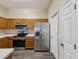 The kitchen features stainless steel appliances, ample storage, and a functional layout at 5048 Teather St, Spring Hill, FL 34608